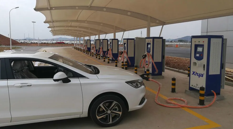 Logistics depot parking area served by EV charging stations under service management